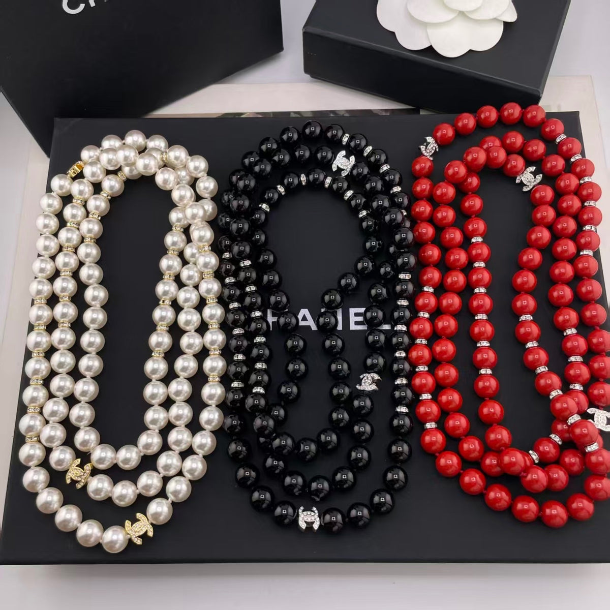 Pearl Strand Necklace with Iconic Logo Accents