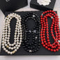 Pearl Strand Necklace with Iconic Logo Accents