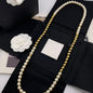 Long Pearl and Metal Bead Station Necklace